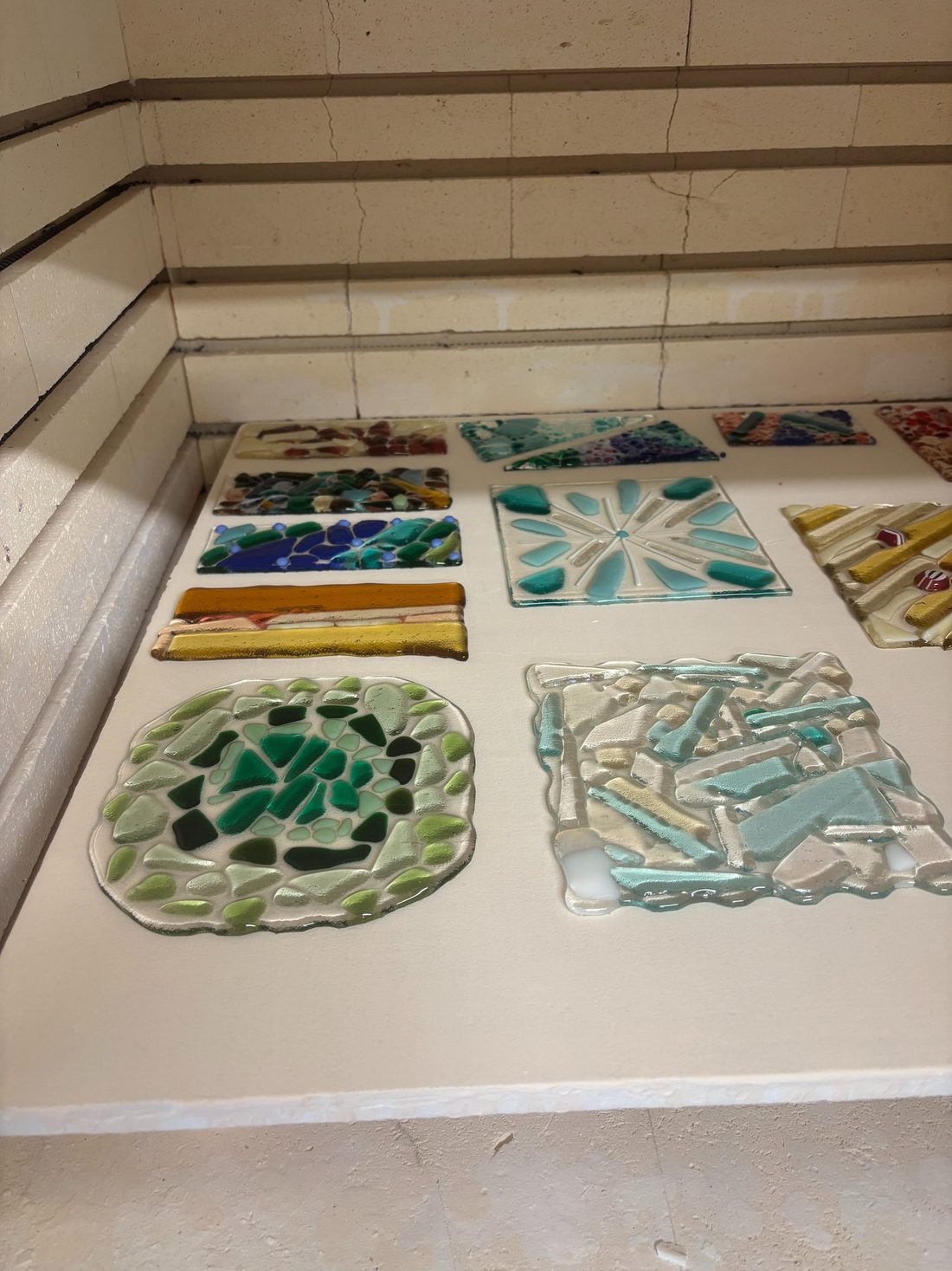 Fused glass tiles after firing